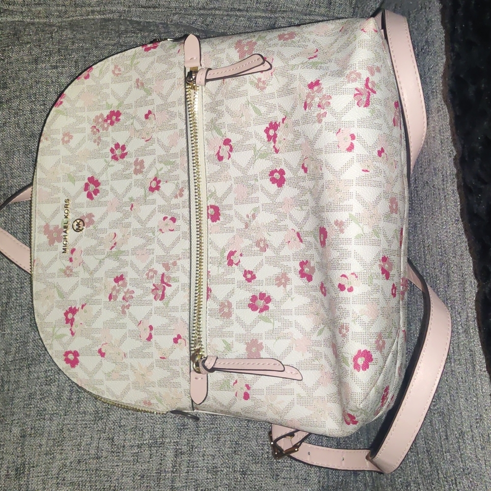 Michael Kors “Dallas” Vanilla Multi Slim Backpack.